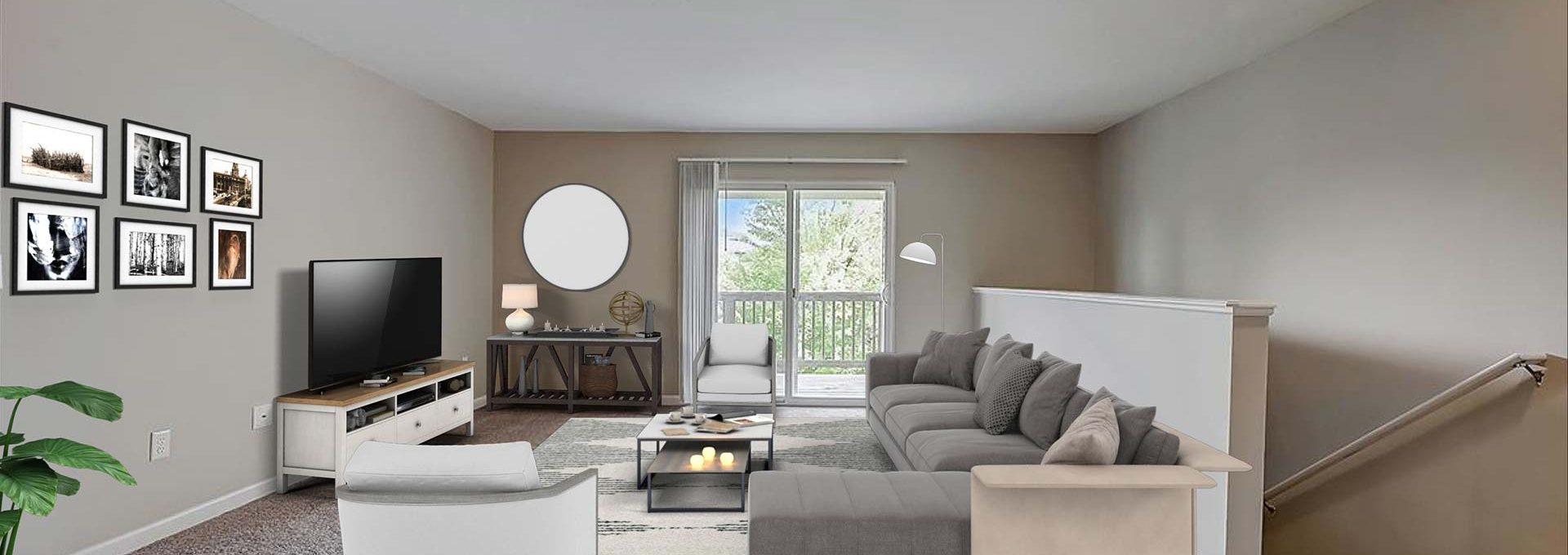 a living room with a couch, coffee table and television at The Worthington Green